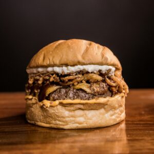 burger on brown wooden table