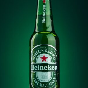 heineken beer bottle on green surface