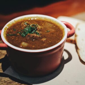 soup in maroon ceramic pot