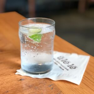 glass of water on brown table